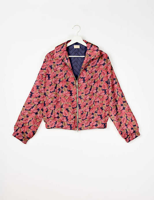 Stylish BOMBER JACKET, an upcycled clothing masterpiece with a cute cropped shape, elasticated details, and detachable metallic zipper. Contrast sari print lining adds a unique touch. Explore sustainable and eco-friendly fashion.