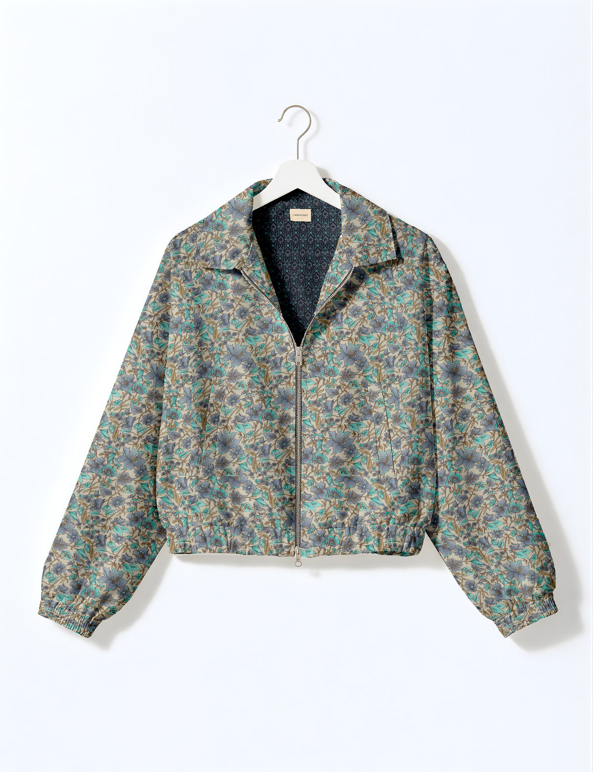 Woman wearing a yellow floral bomber jacket with front zipper, elastic cuffs, and side pockets, shown from front view