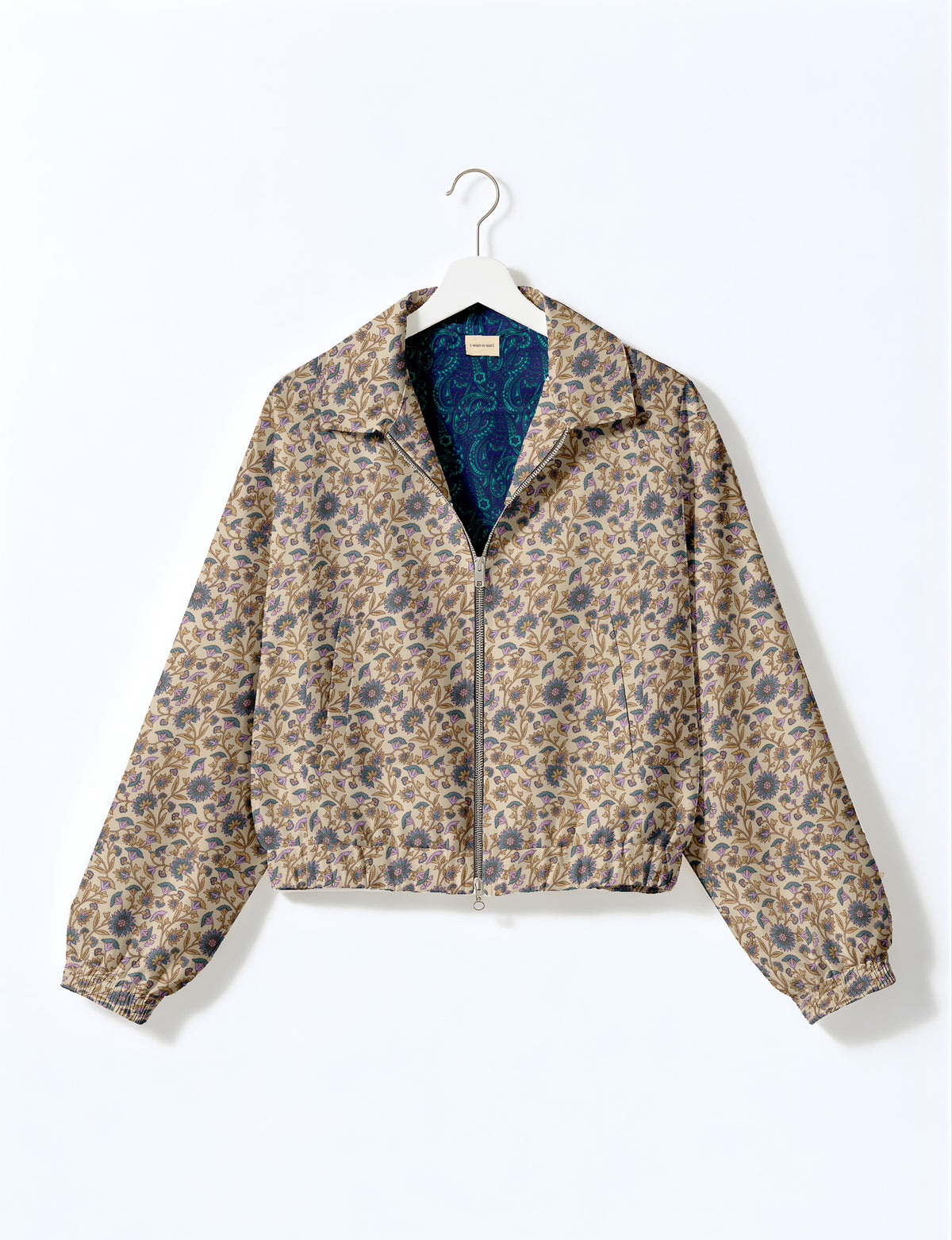 Woman wearing a yellow floral bomber jacket with front zipper, elastic cuffs, and side pockets, shown from front view