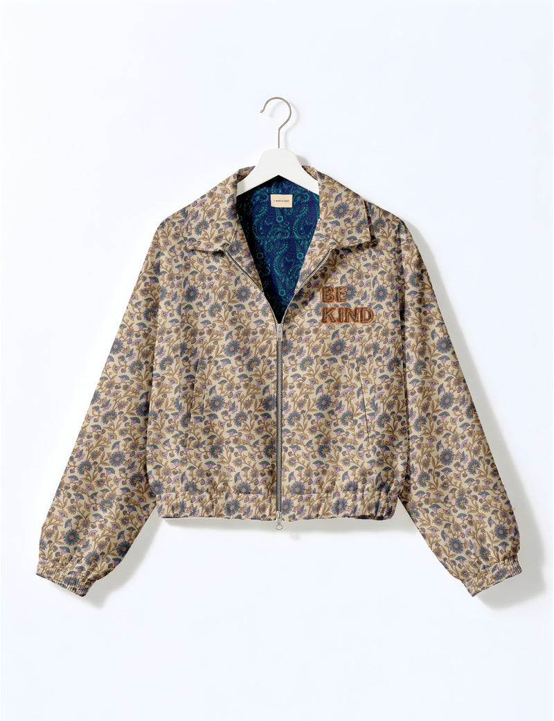 BE KIND Bomber jacket made from upcycled sari fabric with handcrafted Aari embroidery by female artisans.