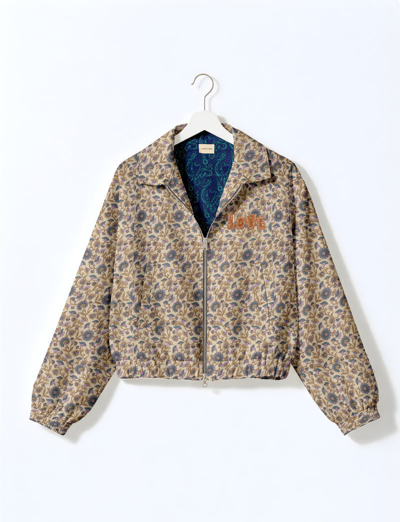 Love Bomber Jacket made from recycled fabric, featuring hand-stitched Aari embroidery. A unique piece of zero-waste clothing, part of the circular fashion movement. Designed with upcycled materials for a stylish yet environmentally friendly clothing choice.