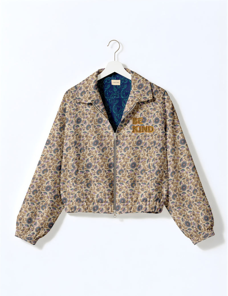 BE KIND Bomber jacket made from upcycled sari fabric with handcrafted Aari embroidery by female artisans.