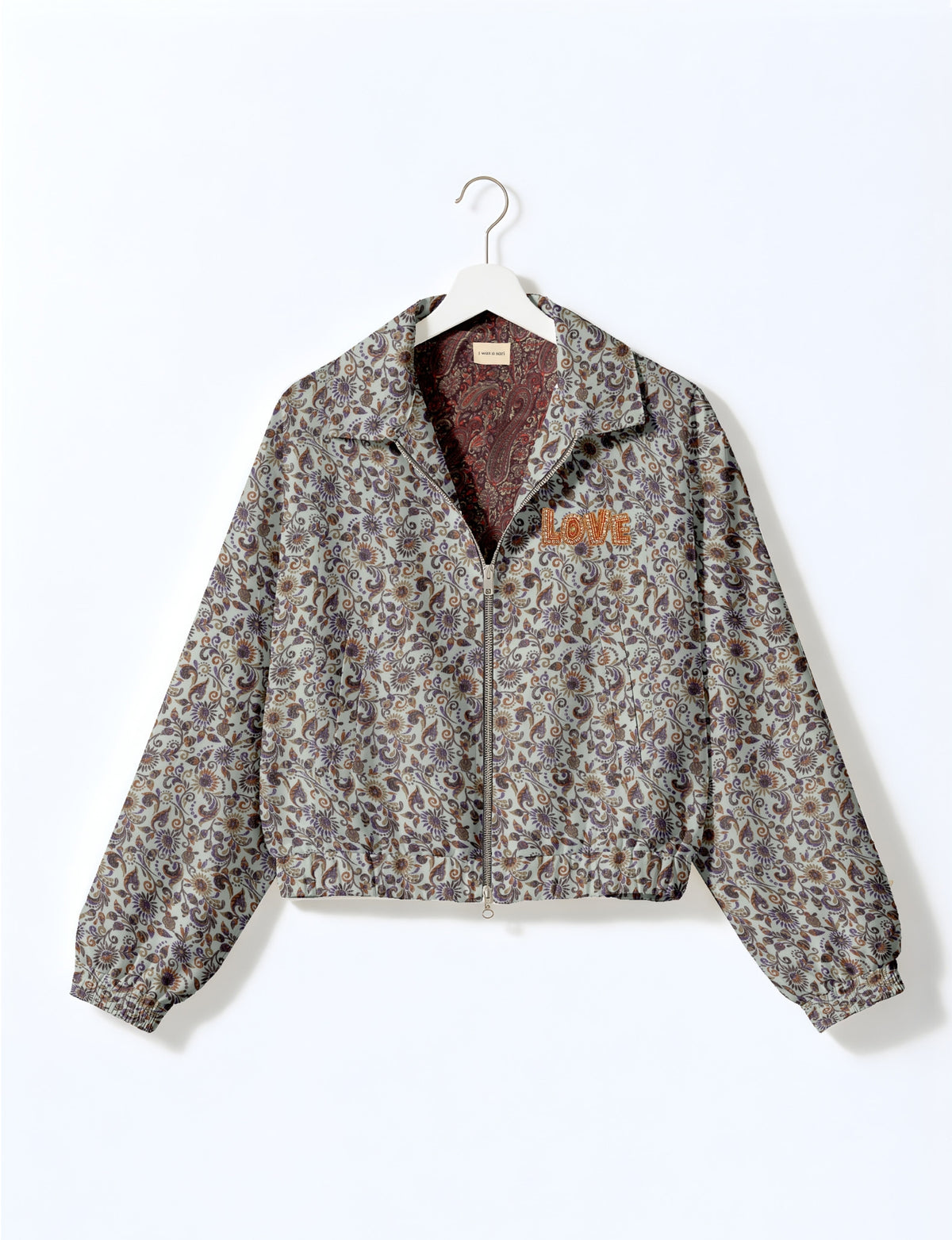 Love Bomber Jacket made from recycled fabric, featuring hand-stitched Aari embroidery. A unique piece of zero-waste clothing, part of the circular fashion movement. Designed with upcycled materials for a stylish yet environmentally friendly clothing choice.