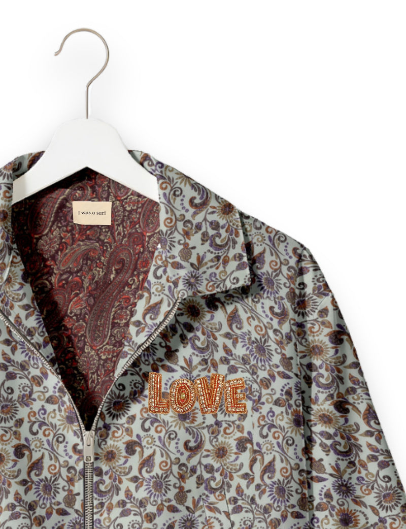 Love Bomber Jacket made from recycled fabric, featuring hand-stitched Aari embroidery. A unique piece of zero-waste clothing, part of the circular fashion movement. Designed with upcycled materials for a stylish yet environmentally friendly clothing choice.