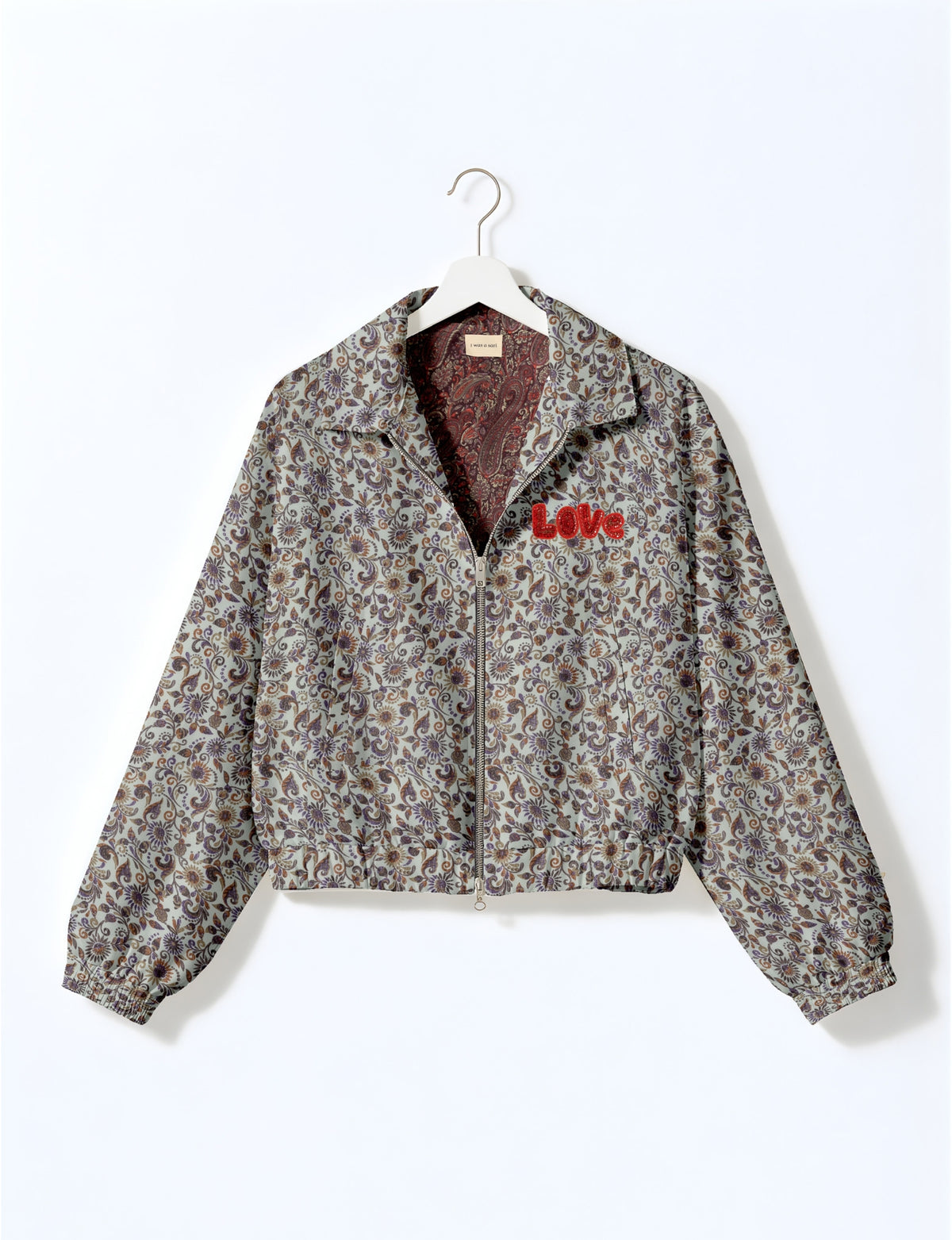 Love Bomber Jacket made from recycled fabric, featuring hand-stitched Aari embroidery. A unique piece of zero-waste clothing, part of the circular fashion movement. Designed with upcycled materials for a stylish yet environmentally friendly clothing choice.