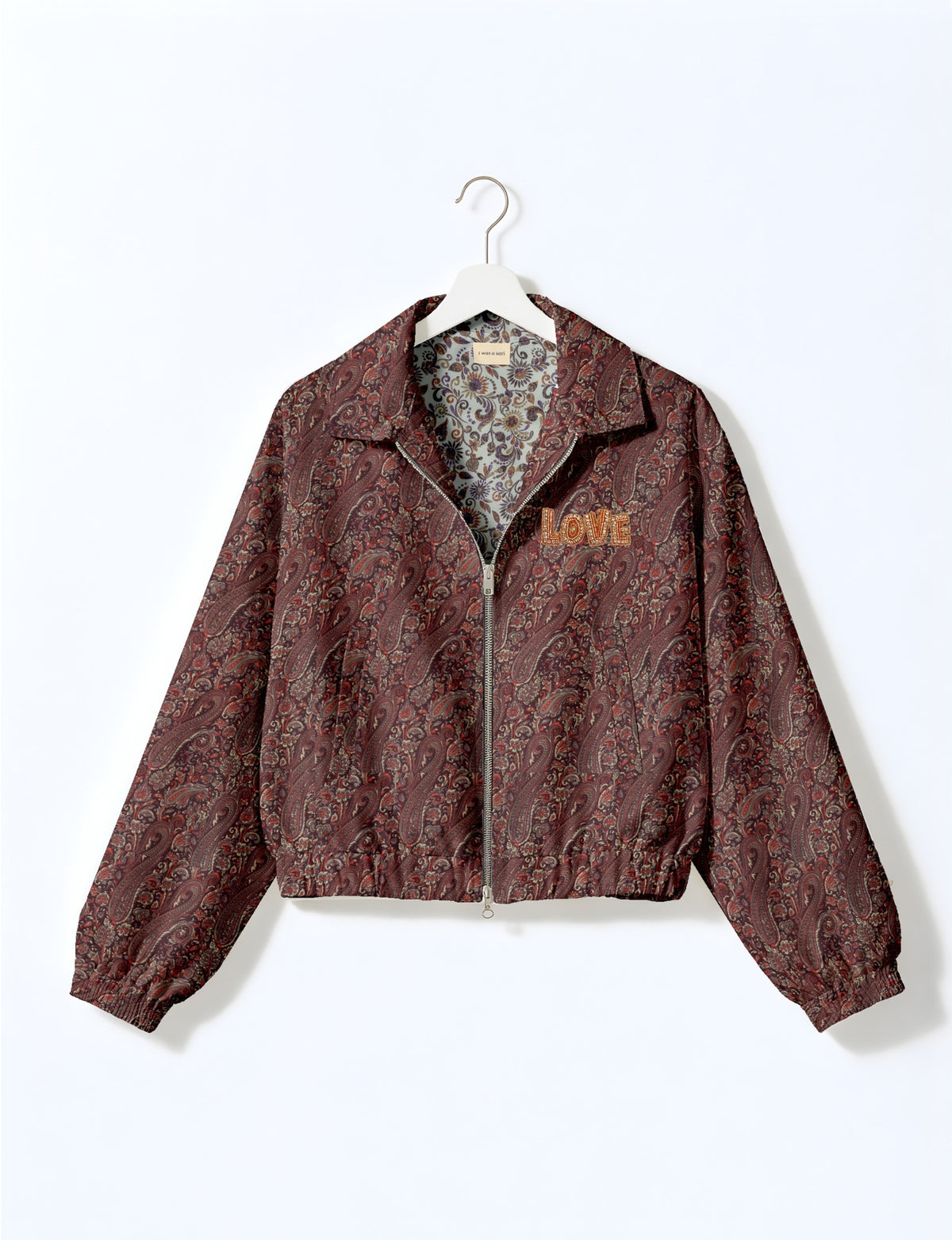 Love Bomber Jacket made from recycled fabric, featuring hand-stitched Aari embroidery. A unique piece of zero-waste clothing, part of the circular fashion movement. Designed with upcycled materials for a stylish yet environmentally friendly clothing choice.