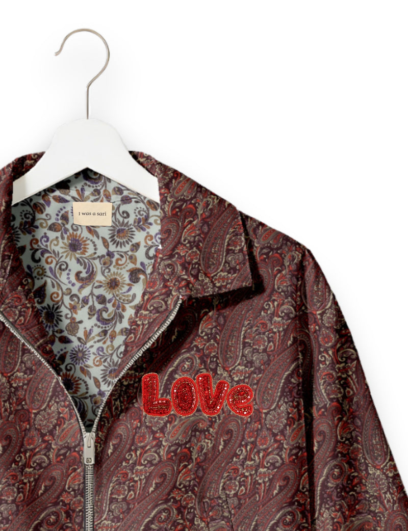 Love Bomber Jacket made from recycled fabric, featuring hand-stitched Aari embroidery. A unique piece of zero-waste clothing, part of the circular fashion movement. Designed with upcycled materials for a stylish yet environmentally friendly clothing choice.
