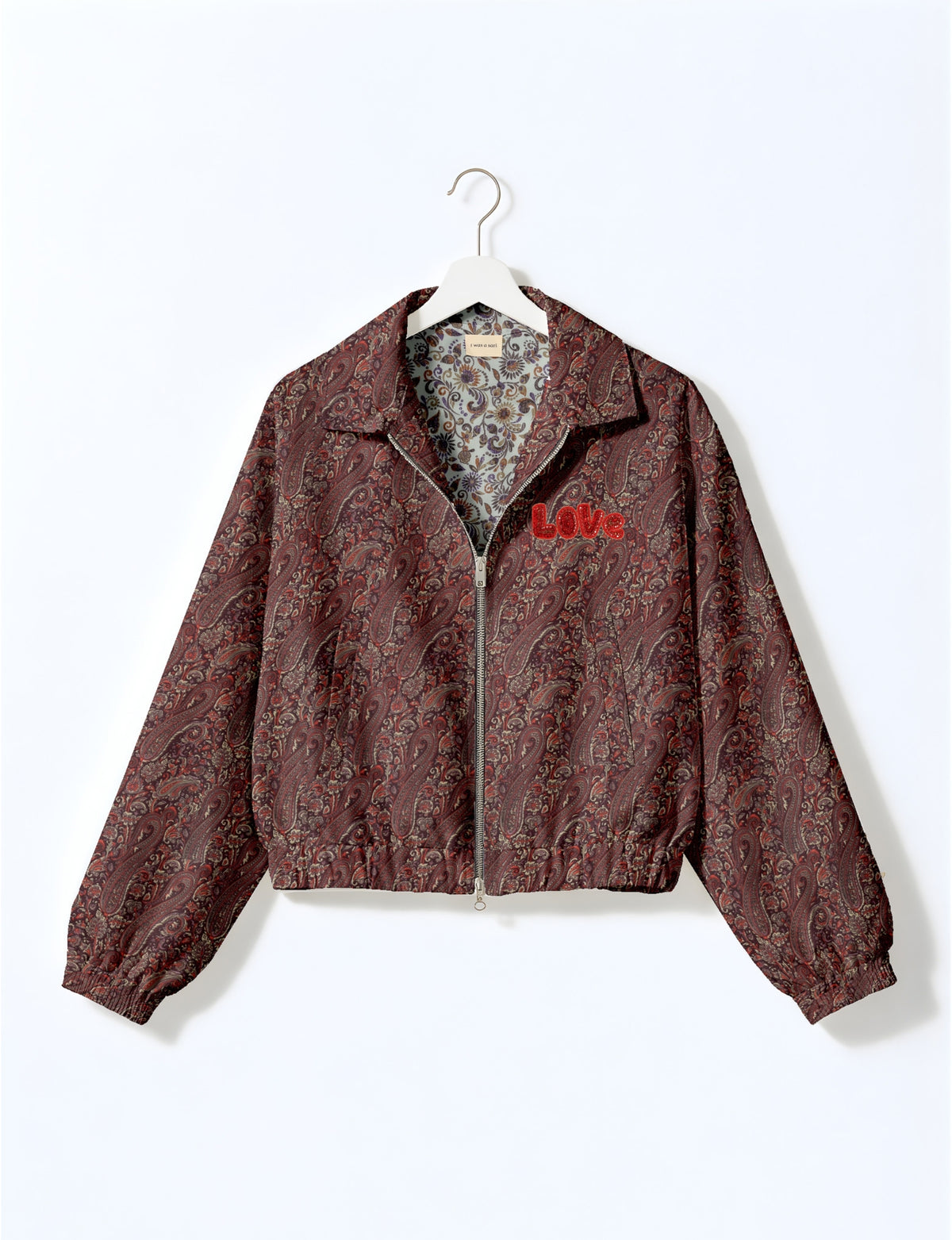 Love Bomber Jacket made from recycled fabric, featuring hand-stitched Aari embroidery. A unique piece of zero-waste clothing, part of the circular fashion movement. Designed with upcycled materials for a stylish yet environmentally friendly clothing choice.