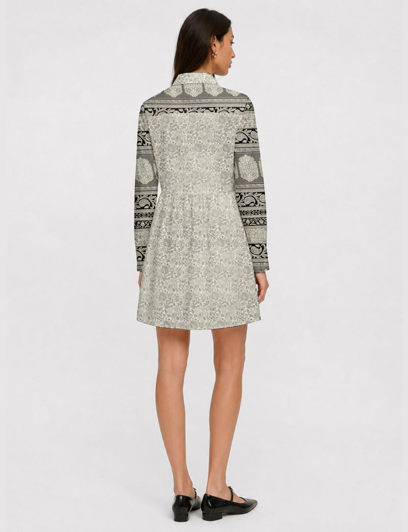 Short shirt dress with a relaxed A-line silhouette, point collar, partial button placket, gathered waist, side pockets, and full-length cuffed sleeves.