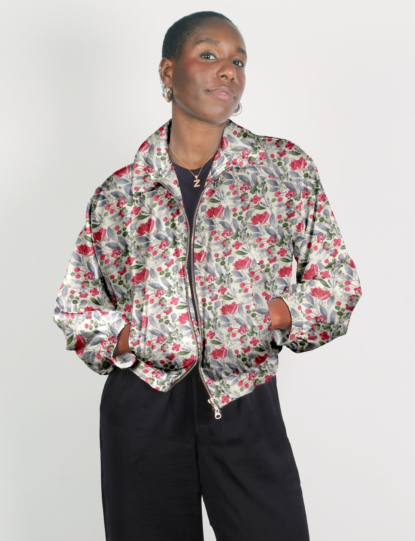 Upcycled Bomber Jacket made from recycled sari materials, featuring a cute cropped shape, elasticated hem and cuffs, and contrast sari print lining. Sustainable apparel promoting eco-friendly fashion and ethical clothing.