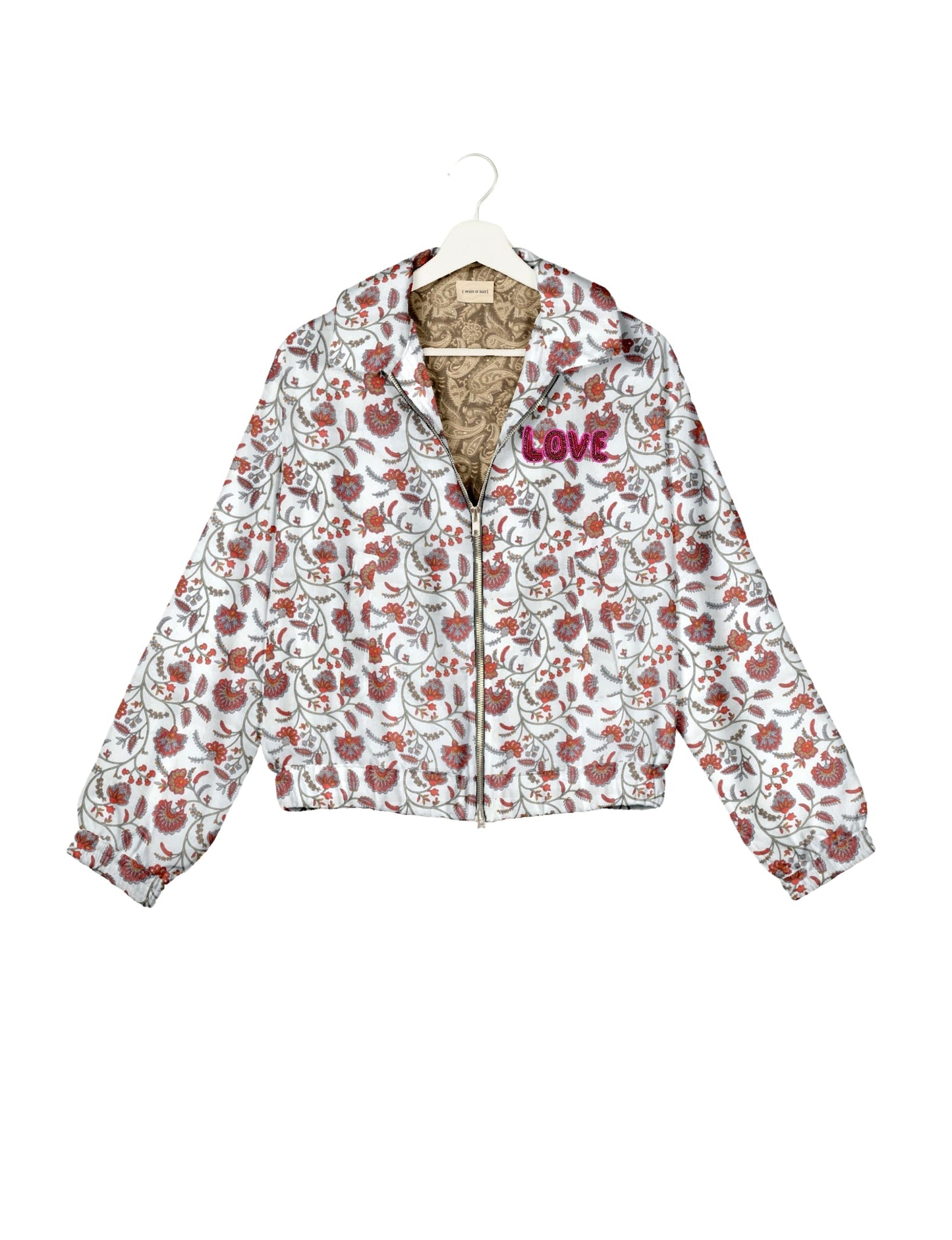 Love Bomber Jacket made from recycled fabric, featuring hand-stitched Aari embroidery. A unique piece of zero-waste clothing, part of the circular fashion movement. Designed with upcycled materials for a stylish yet environmentally friendly clothing choice.