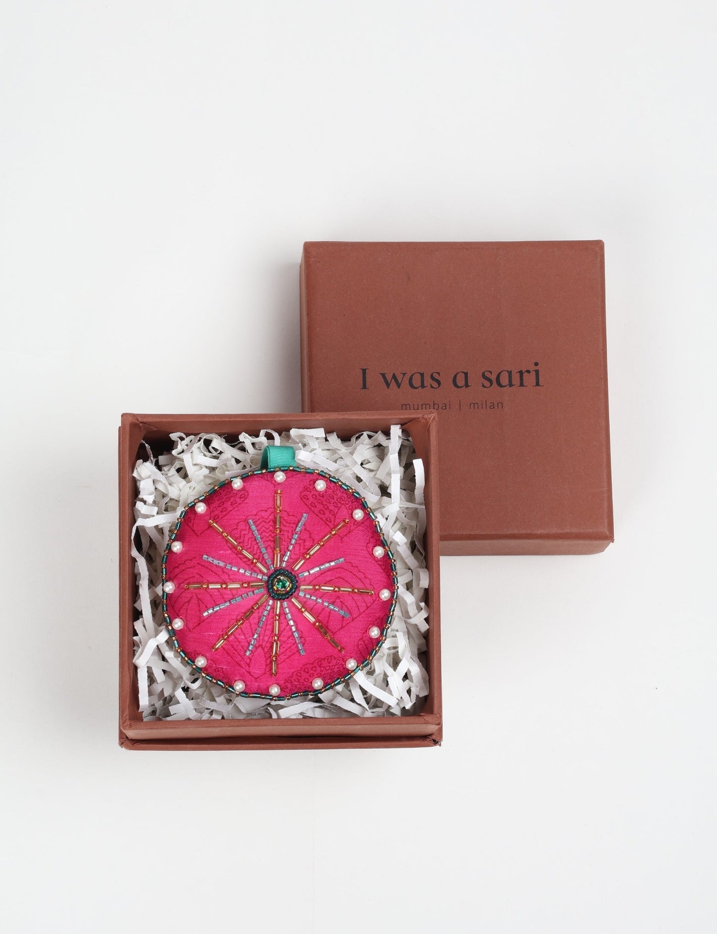 Handcrafted full moon ornament made from recycled sari fabric and embroidered with beads — an example of upcycled clothing and slow fashion, promoting eco clothing, recycled fashion, and conscious clothing practices.