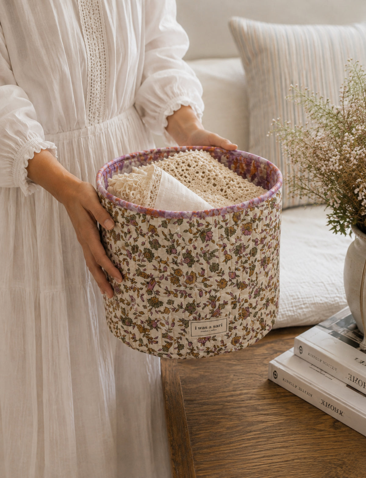 Quilted storage basket in a soft cylindrical shape, available in S, M, L, and XL sizes