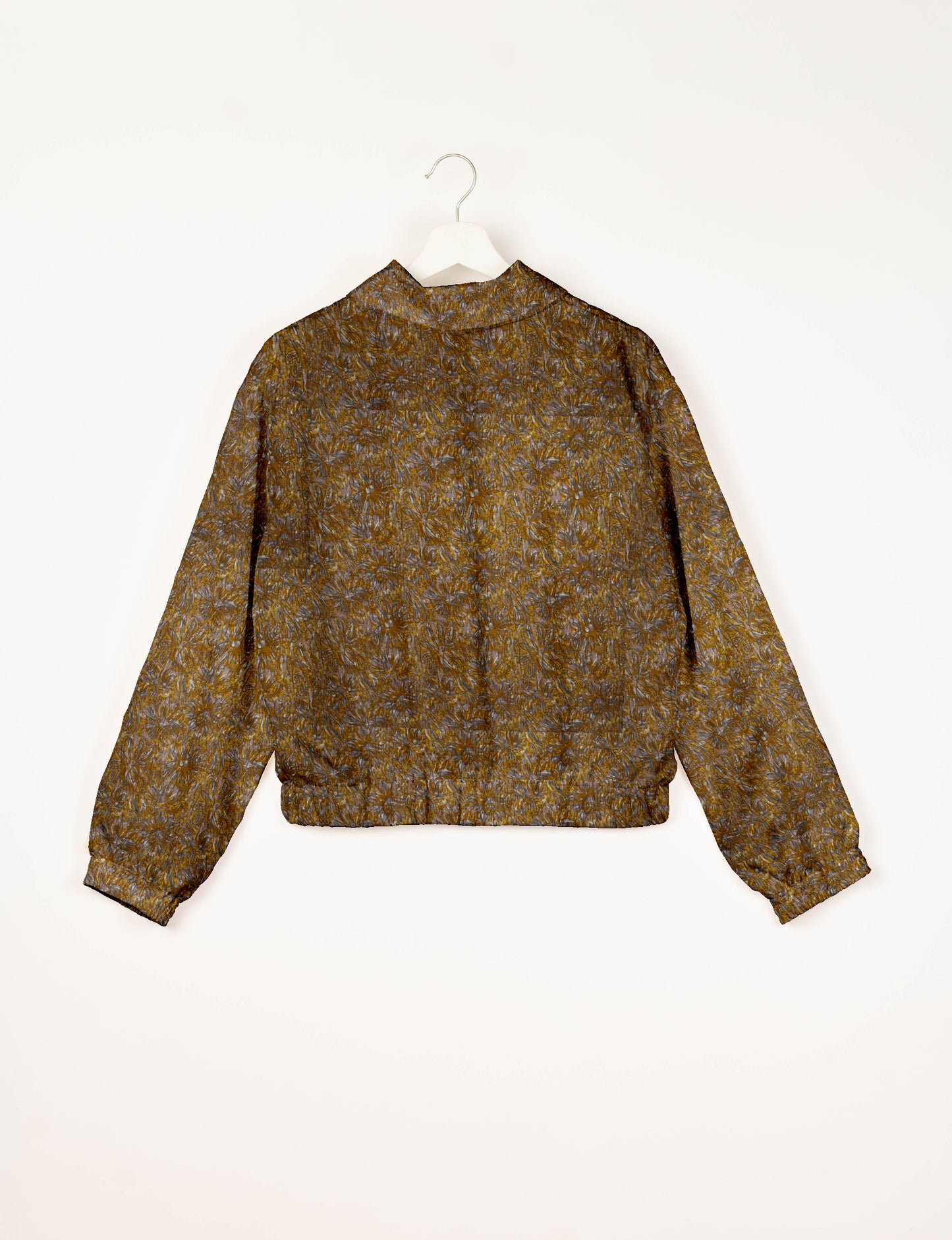 Upcycled Bomber Jacket made from recycled sari materials, featuring a cute cropped shape, elasticated hem and cuffs, and contrast sari print lining. Sustainable apparel promoting eco-friendly fashion and ethical clothing.