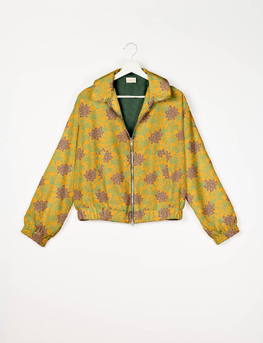 Stylish BOMBER JACKET, an upcycled clothing masterpiece with a cute cropped shape, elasticated details, and detachable metallic zipper. Contrast sari print lining adds a unique touch. Explore sustainable and eco-friendly fashion.