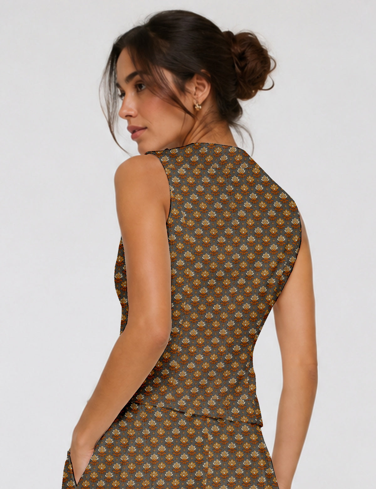 Women's fitted waistcoat with V-neck, single-breasted button closure, tailored silhouette, and pointed hem in sustainable fashion.