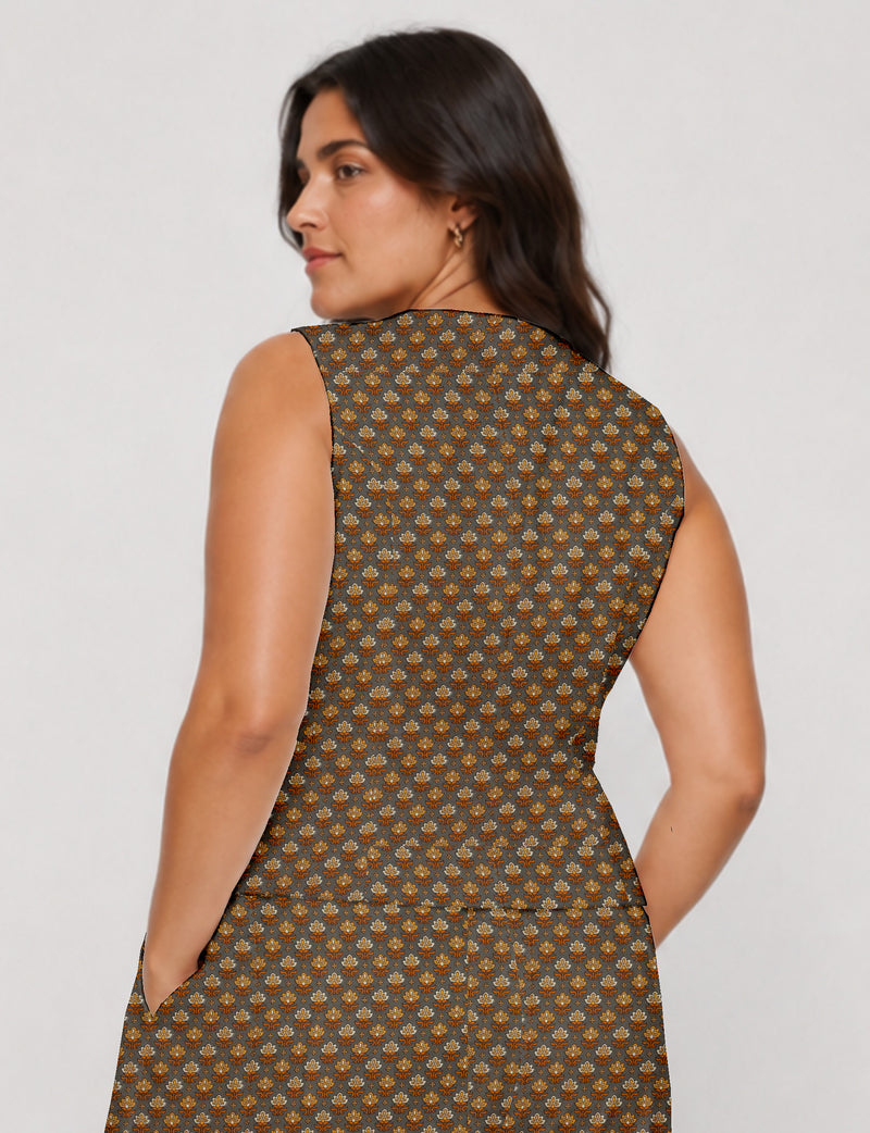 Women's fitted waistcoat with V-neck, single-breasted button closure, tailored silhouette, and pointed hem in sustainable fashion.