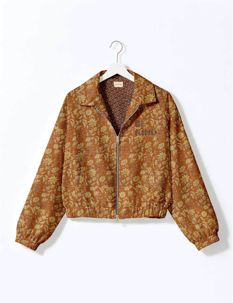 BE KIND Bomber jacket made from upcycled sari fabric with handcrafted Aari embroidery by female artisans.