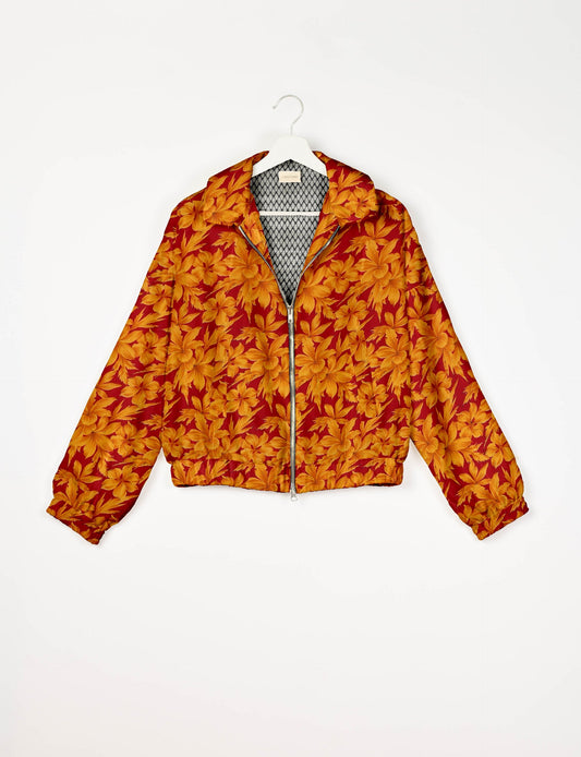 Stylish BOMBER JACKET, an upcycled clothing masterpiece with a cute cropped shape, elasticated details, and detachable metallic zipper. Contrast sari print lining adds a unique touch. Explore sustainable and eco-friendly fashion.