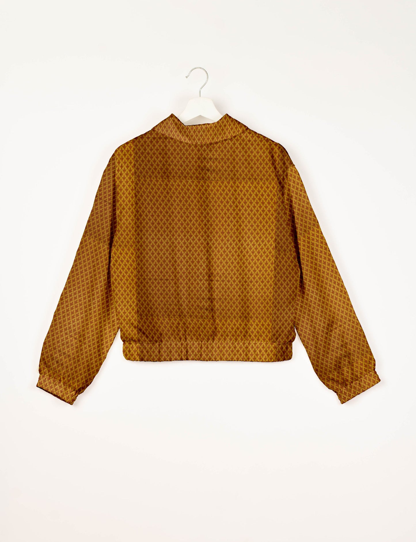 Upcycled Bomber Jacket made from recycled sari materials, featuring a cute cropped shape, elasticated hem and cuffs, and contrast sari print lining. Sustainable apparel promoting eco-friendly fashion and ethical clothing.