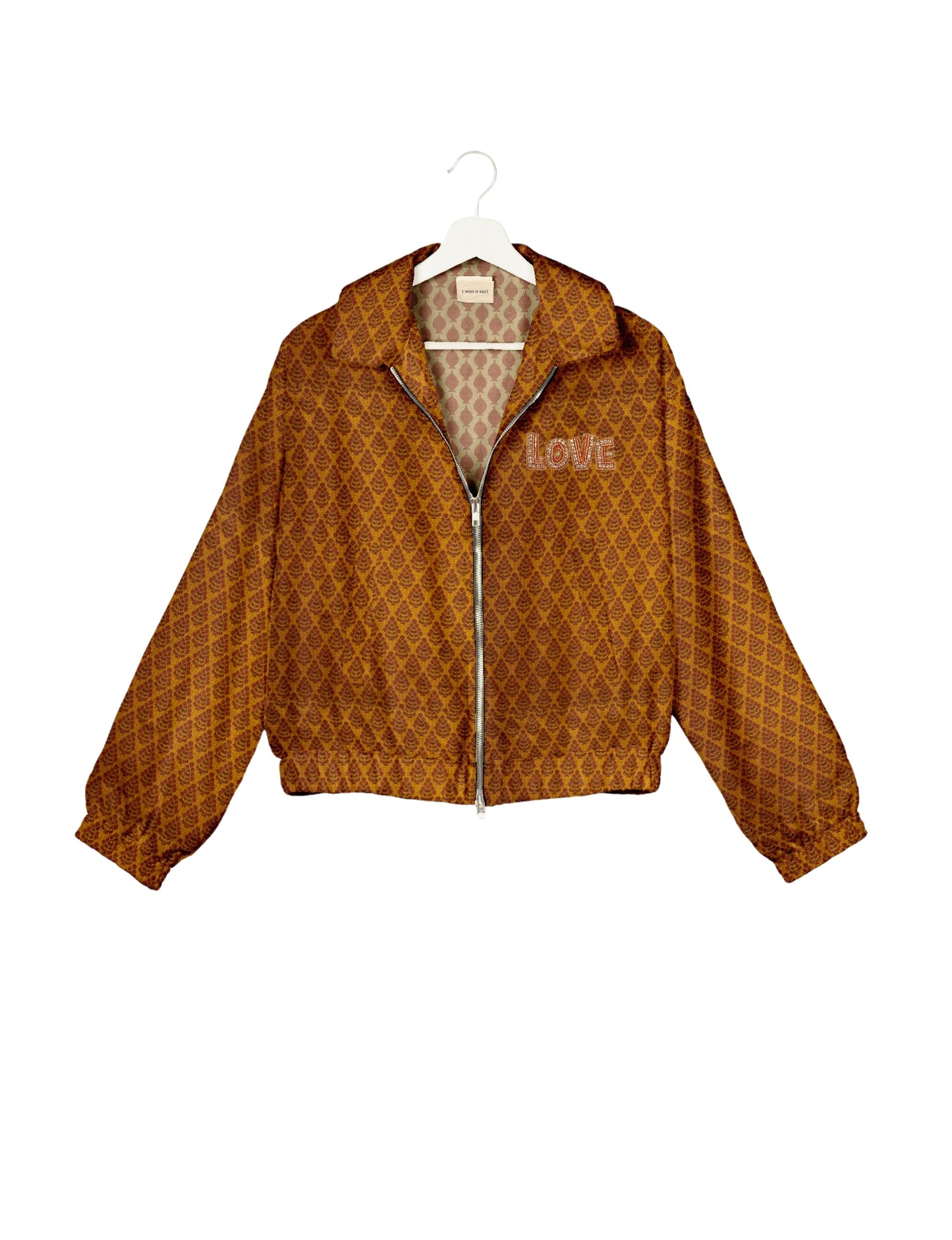 Love Bomber Jacket made from recycled fabric, featuring hand-stitched Aari embroidery. A unique piece of zero-waste clothing, part of the circular fashion movement. Designed with upcycled materials for a stylish yet environmentally friendly clothing choice.