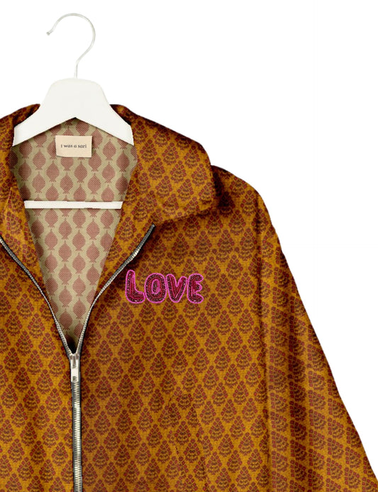 Love Bomber Jacket made from recycled fabric, featuring hand-stitched Aari embroidery. A unique piece of zero-waste clothing, part of the circular fashion movement. Designed with upcycled materials for a stylish yet environmentally friendly clothing choice.
