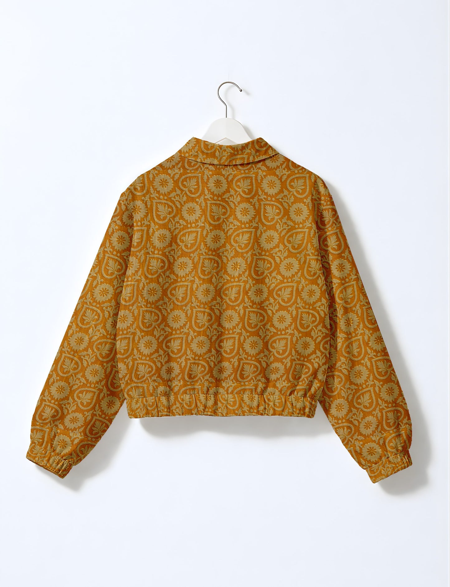 Upcycled Bomber Jacket made from recycled sari materials, featuring a cute cropped shape, elasticated hem and cuffs, and contrast sari print lining. Sustainable apparel promoting eco-friendly fashion and ethical clothing.