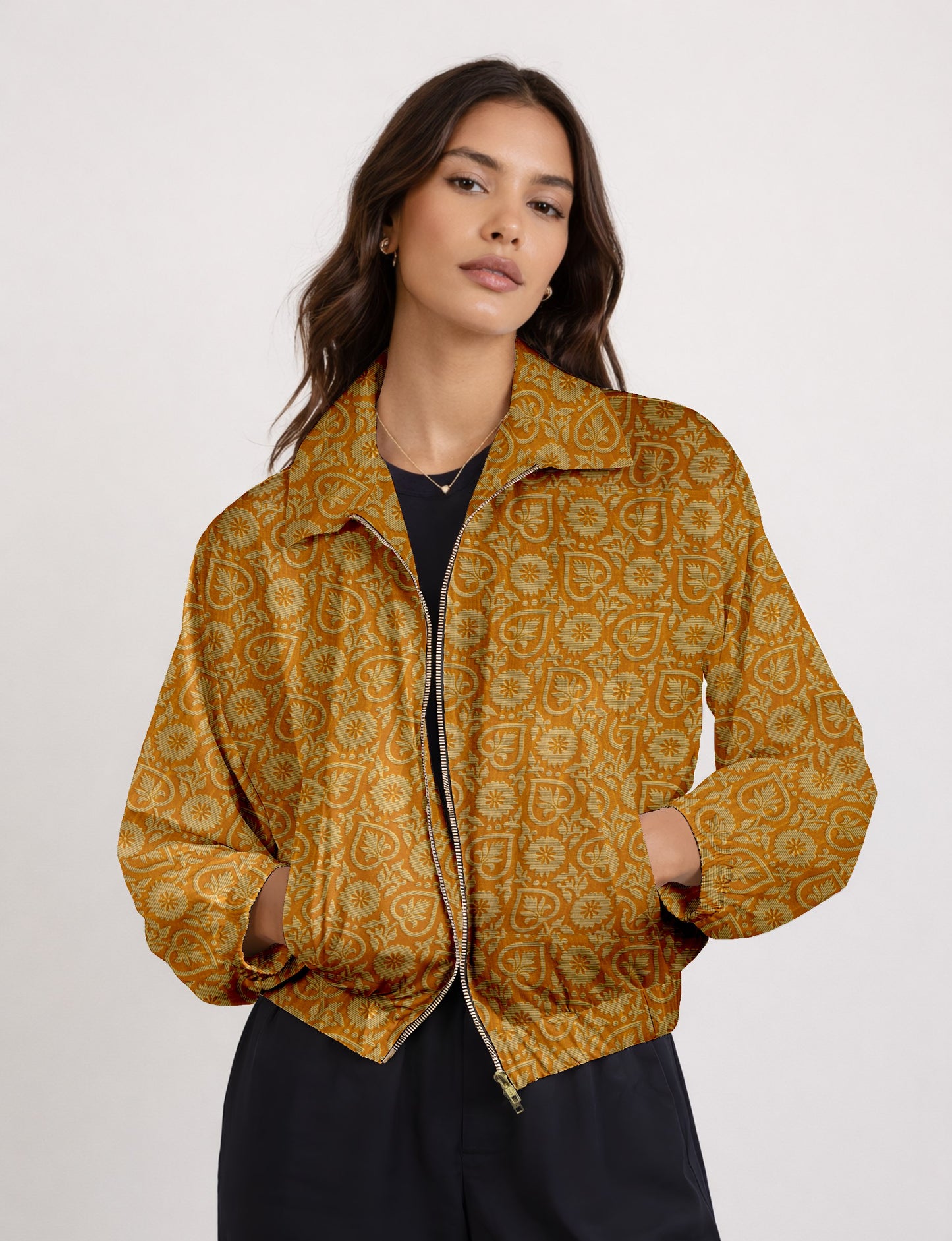 Upcycled Bomber Jacket made from recycled sari materials, featuring a cute cropped shape, elasticated hem and cuffs, and contrast sari print lining. Sustainable apparel promoting eco-friendly fashion and ethical clothing.