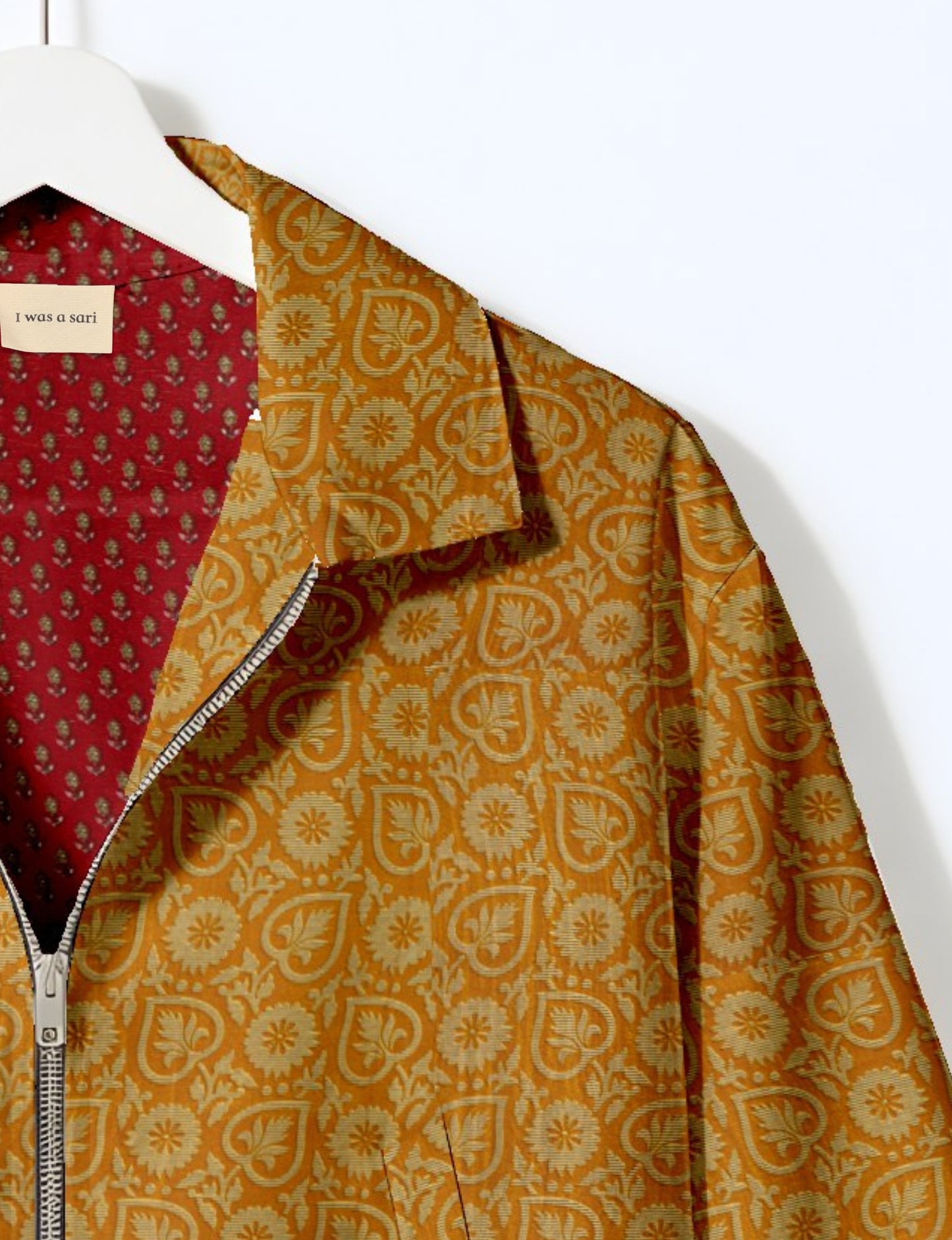 Upcycled Bomber Jacket made from recycled sari materials, featuring a cute cropped shape, elasticated hem and cuffs, and contrast sari print lining. Sustainable apparel promoting eco-friendly fashion and ethical clothing.