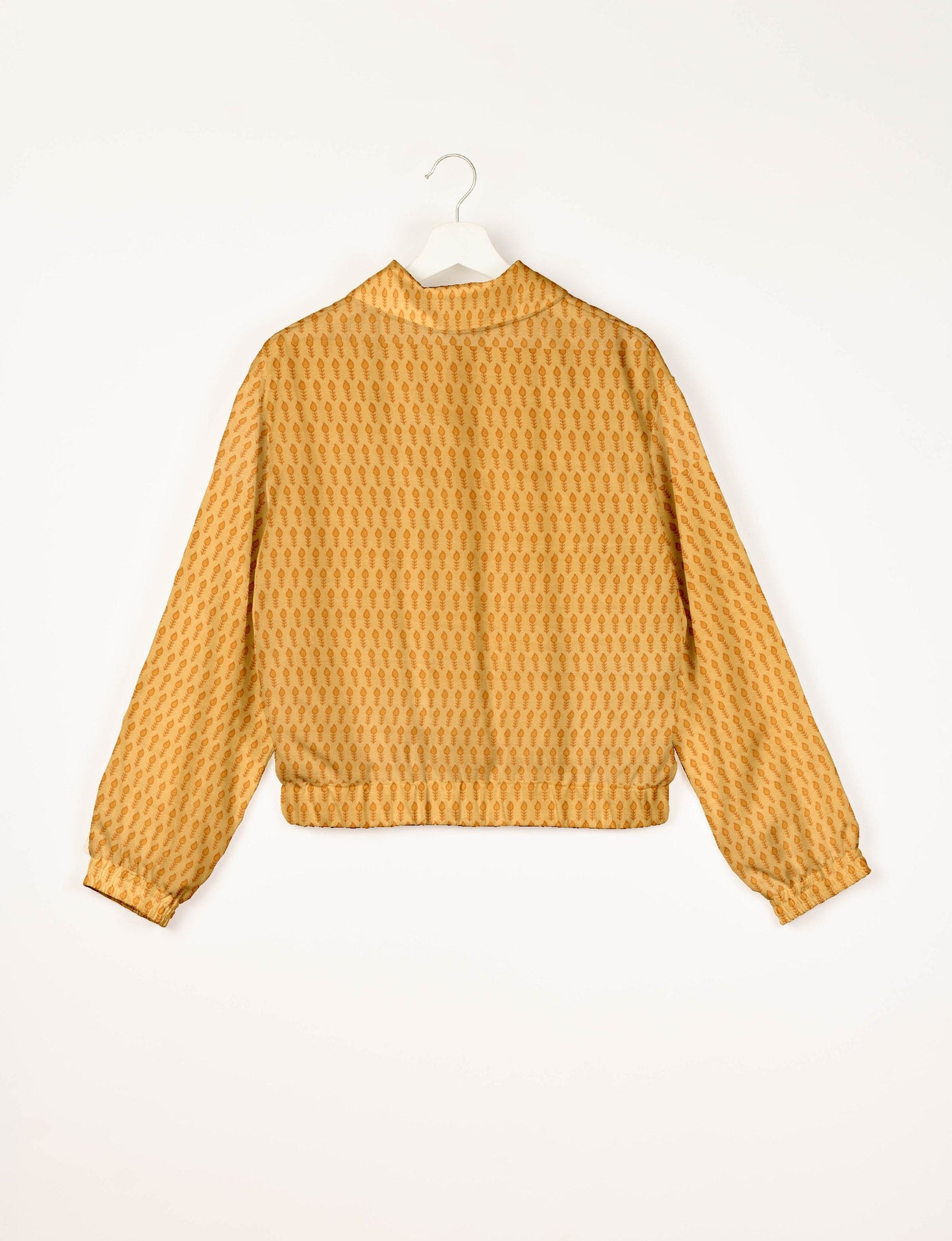 Upcycled Bomber Jacket made from recycled sari materials, featuring a cute cropped shape, elasticated hem and cuffs, and contrast sari print lining. Sustainable apparel promoting eco-friendly fashion and ethical clothing.