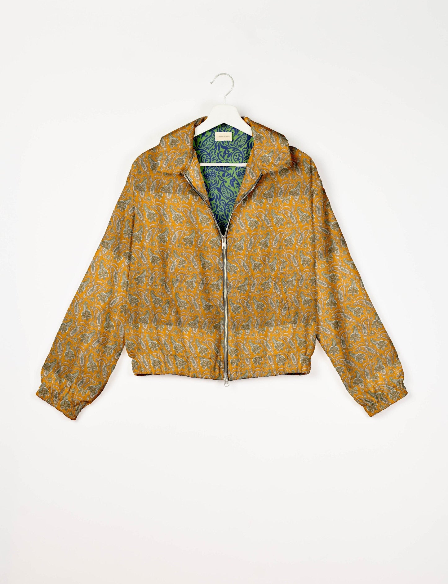 Upcycled Bomber Jacket made from recycled sari materials, featuring a cute cropped shape, elasticated hem and cuffs, and contrast sari print lining. Sustainable apparel promoting eco-friendly fashion and ethical clothing.
