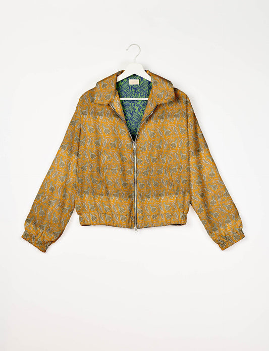 Upcycled Bomber Jacket made from recycled sari materials, featuring a cute cropped shape, elasticated hem and cuffs, and contrast sari print lining. Sustainable apparel promoting eco-friendly fashion and ethical clothing.