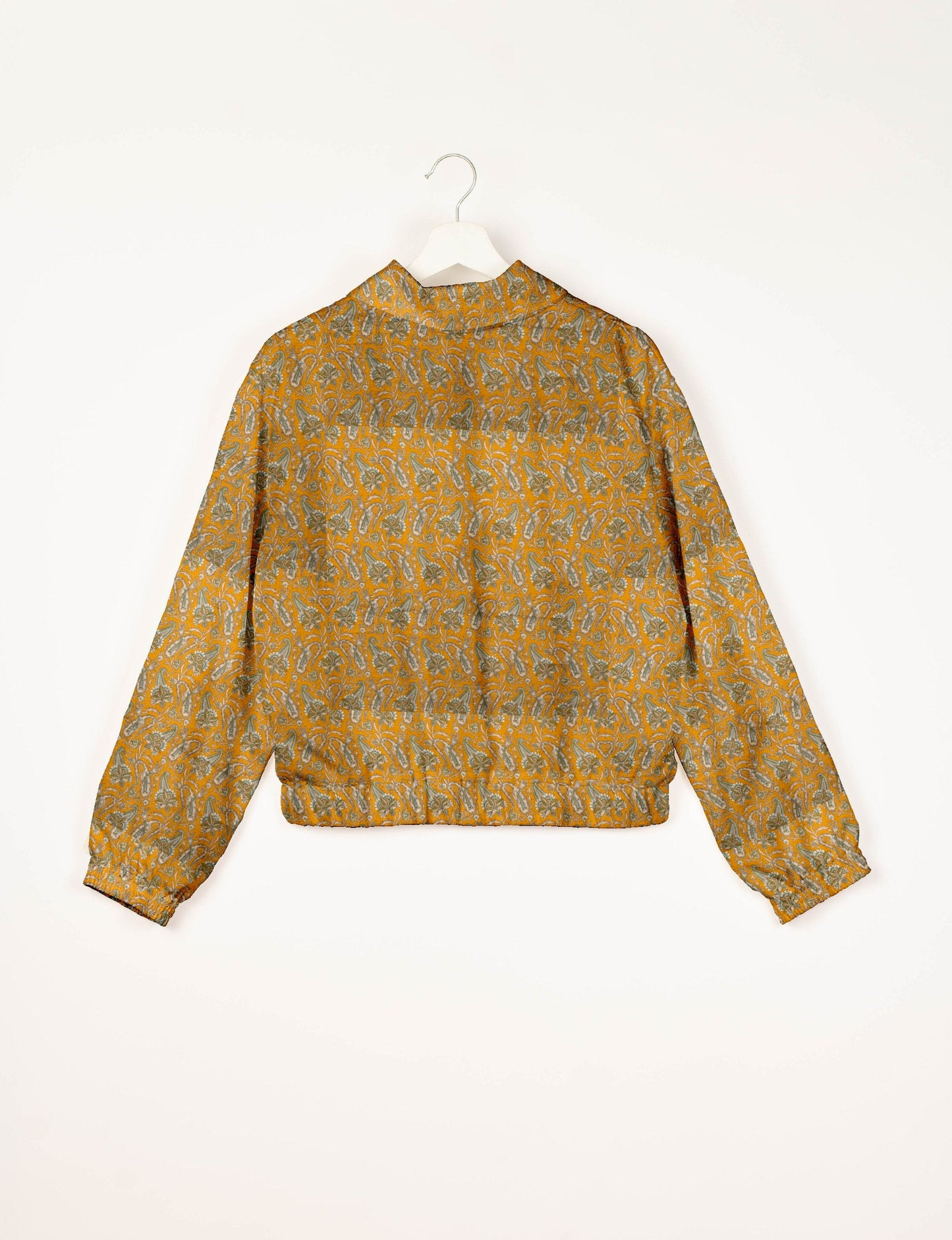 Upcycled Bomber Jacket made from recycled sari materials, featuring a cute cropped shape, elasticated hem and cuffs, and contrast sari print lining. Sustainable apparel promoting eco-friendly fashion and ethical clothing.