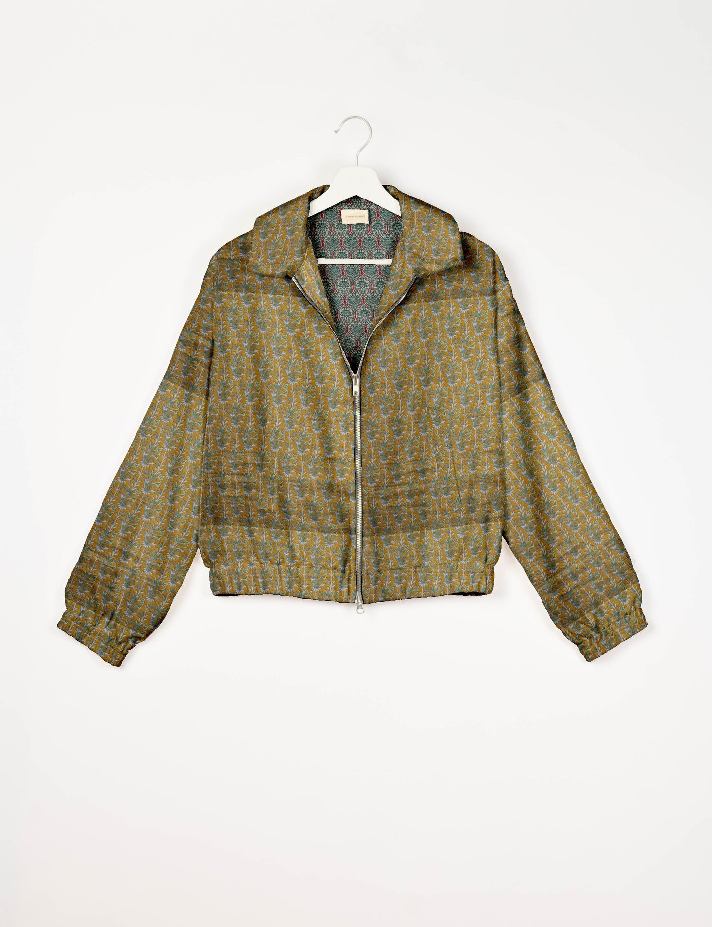 Upcycled Bomber Jacket made from recycled sari materials, featuring a cute cropped shape, elasticated hem and cuffs, and contrast sari print lining. Sustainable apparel promoting eco-friendly fashion and ethical clothing.