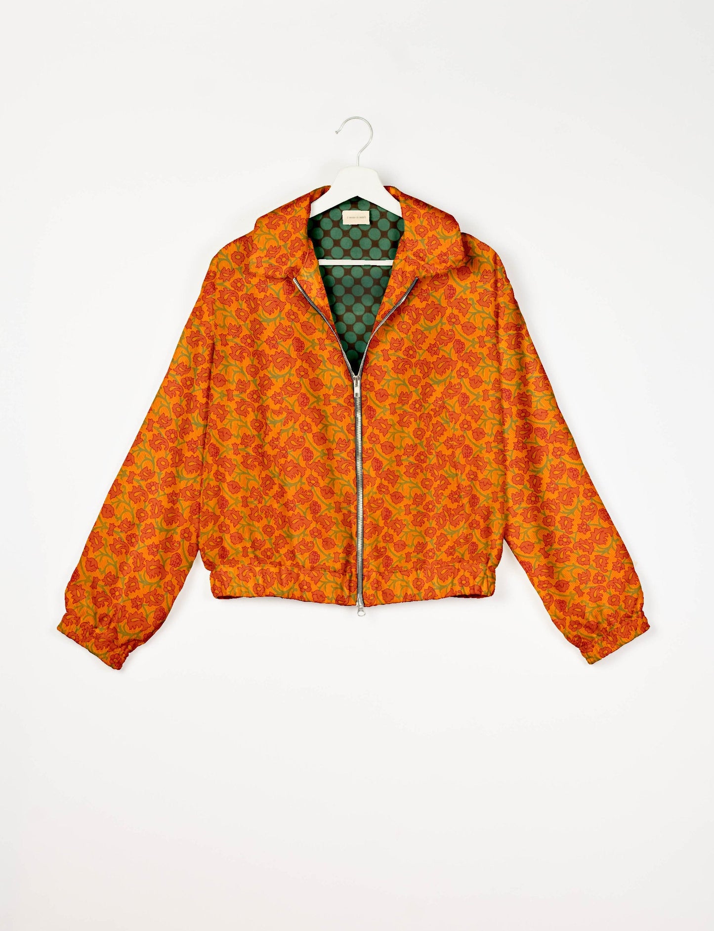 Stylish BOMBER JACKET, an upcycled clothing masterpiece with a cute cropped shape, elasticated details, and detachable metallic zipper. Contrast sari print lining adds a unique touch. Explore sustainable and eco-friendly fashion.