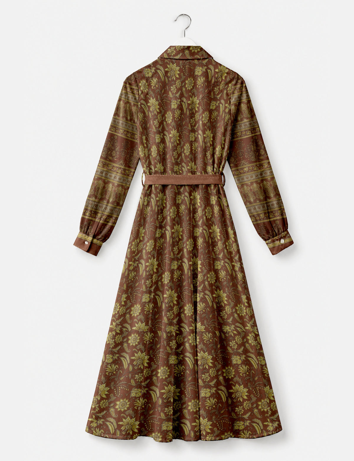 Long brown shirt dress with yellow floral and paisley print, long sleeves with button cuffs, and a matching belt, back view
