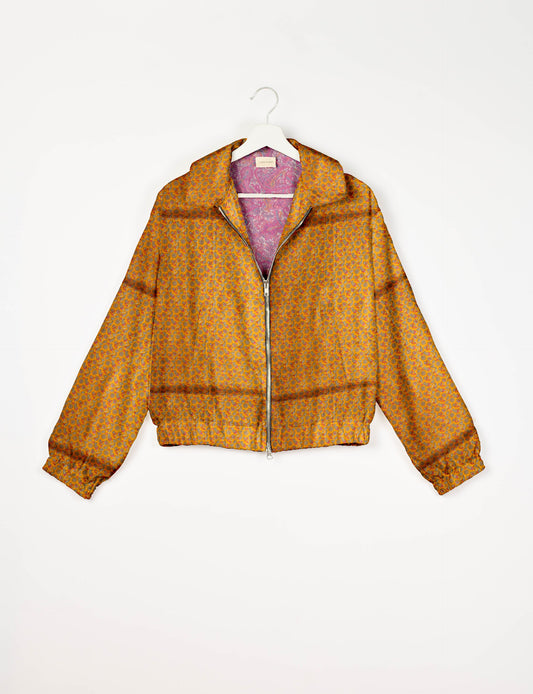 Upcycled Bomber Jacket made from recycled sari materials, featuring a cute cropped shape, elasticated hem and cuffs, and contrast sari print lining. Sustainable apparel promoting eco-friendly fashion and ethical clothing.