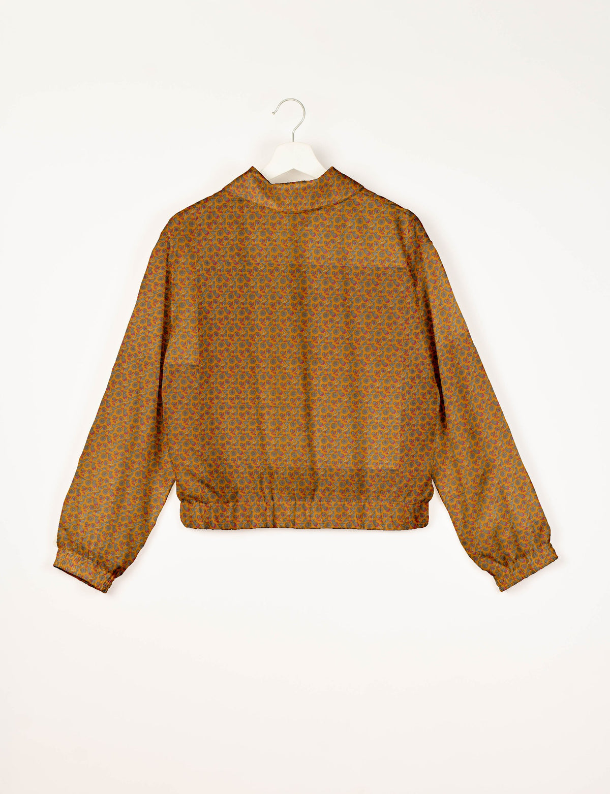 Yellow bomber jacket with tropical floral pattern, elastic cuffs and waistband, shown from back on white hanger