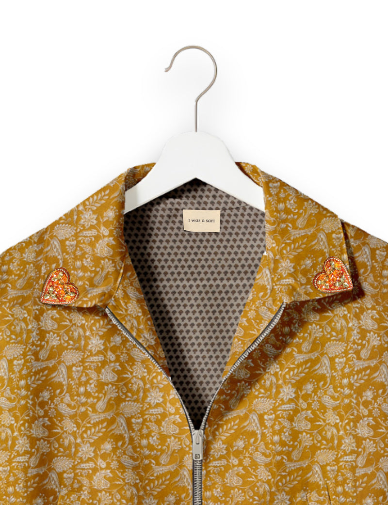 Love Bomber Jacket made from recycled fabric, featuring hand-stitched Aari embroidery. A unique piece of zero-waste clothing, part of the circular fashion movement. Designed with upcycled materials for a stylish yet environmentally friendly clothing choice.