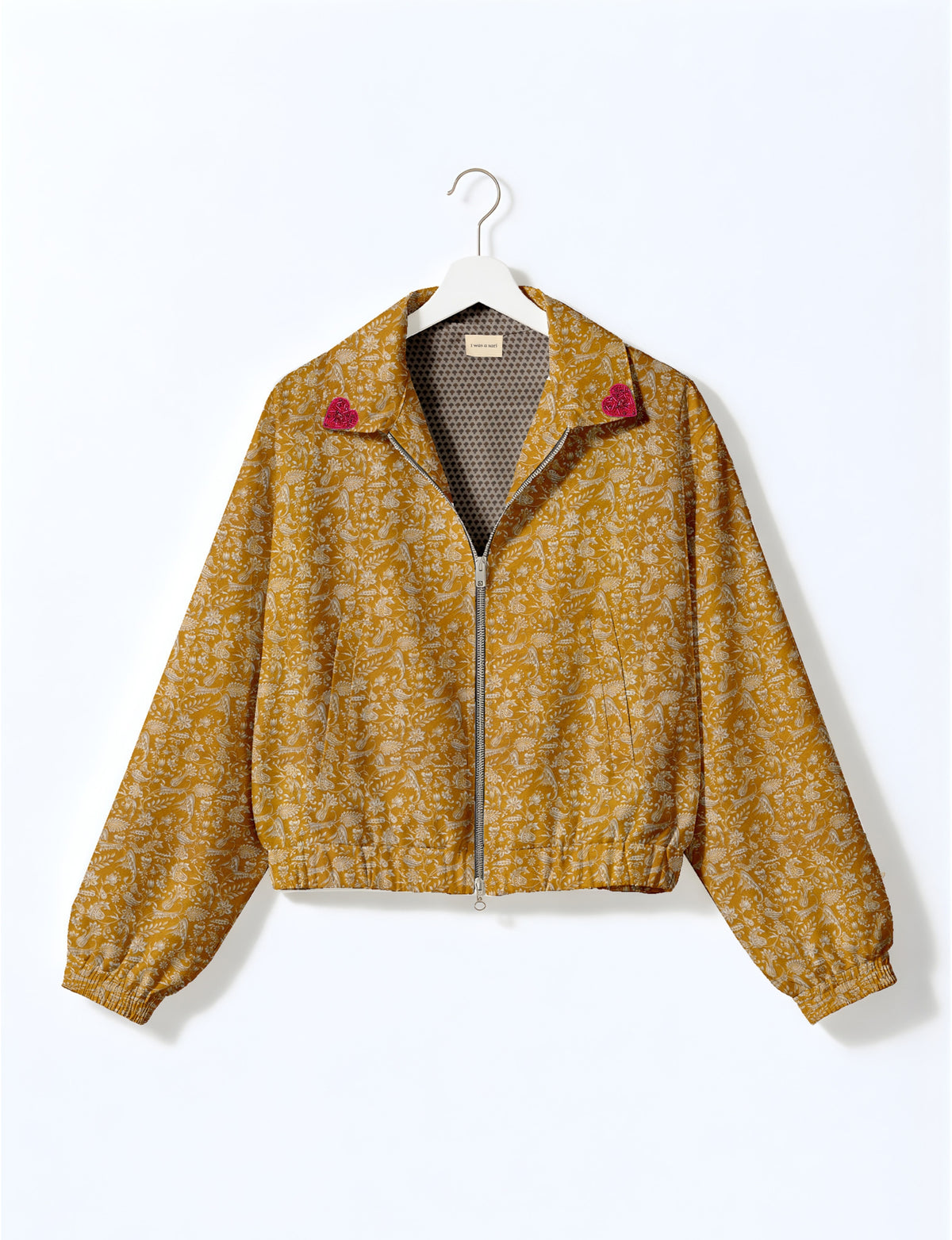 Love Bomber Jacket made from recycled fabric, featuring hand-stitched Aari embroidery. A unique piece of zero-waste clothing, part of the circular fashion movement. Designed with upcycled materials for a stylish yet environmentally friendly clothing choice.