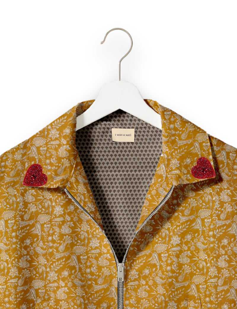 Love Bomber Jacket made from recycled fabric, featuring hand-stitched Aari embroidery. A unique piece of zero-waste clothing, part of the circular fashion movement. Designed with upcycled materials for a stylish yet environmentally friendly clothing choice.
