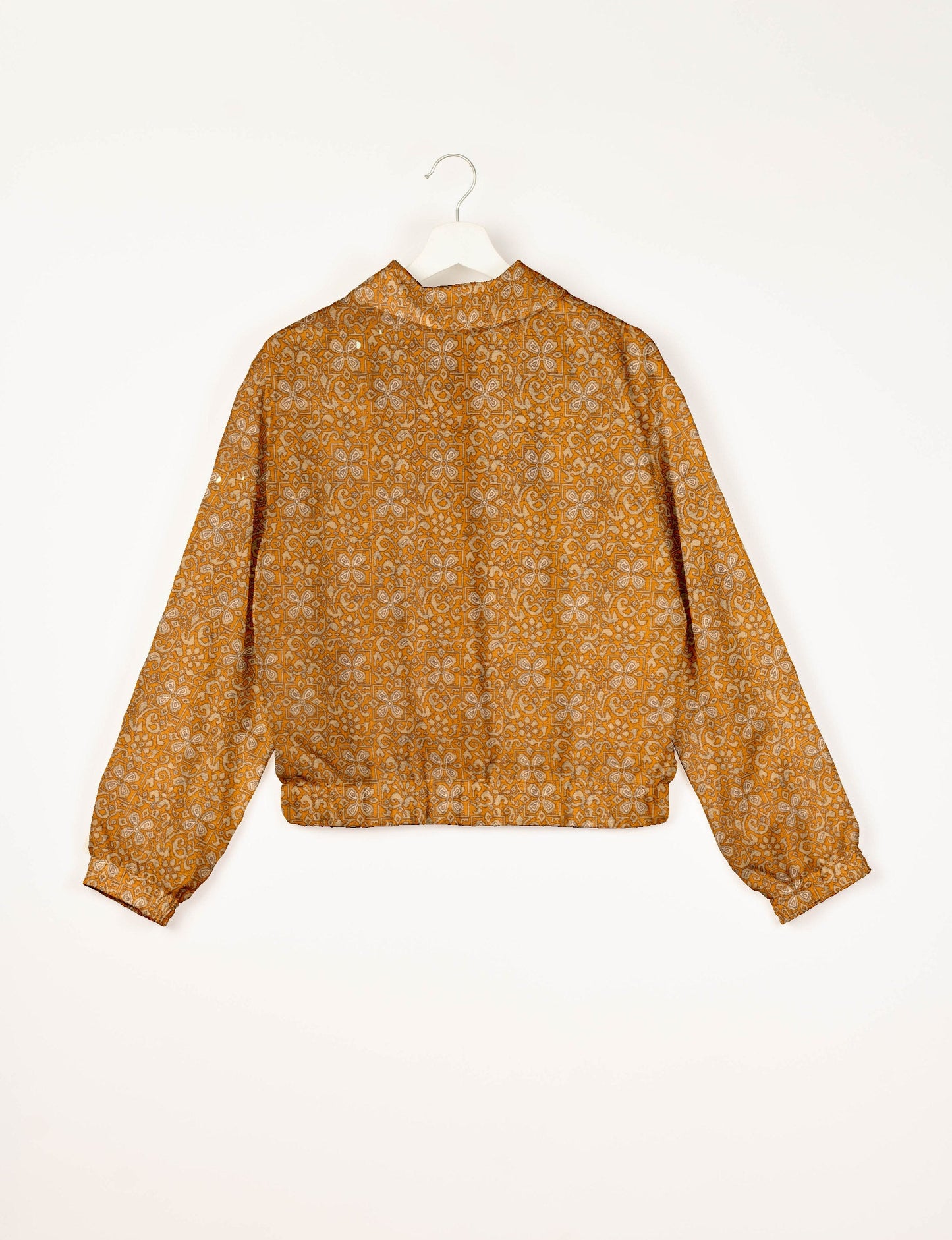 Love Bomber Jacket made from recycled fabric, featuring hand-stitched Aari embroidery. A unique piece of zero-waste clothing, part of the circular fashion movement. Designed with upcycled materials for a stylish yet environmentally friendly clothing choice.