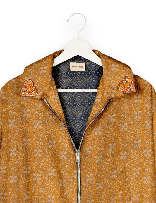 Make a bold statement with our Heart Drop Earrings, a symbol of conscious luxury and ethical fashion. Handcrafted using the intricate Aari embroidery technique, these earrings are made from upcycled sari fabric, embracing slow fashion and zero waste clothing. Elevate your look with sustainable apparel that supports fair trade fashion while reducing textile waste. Choose eco-friendly fashion that speaks of love, artistry, and responsibility.