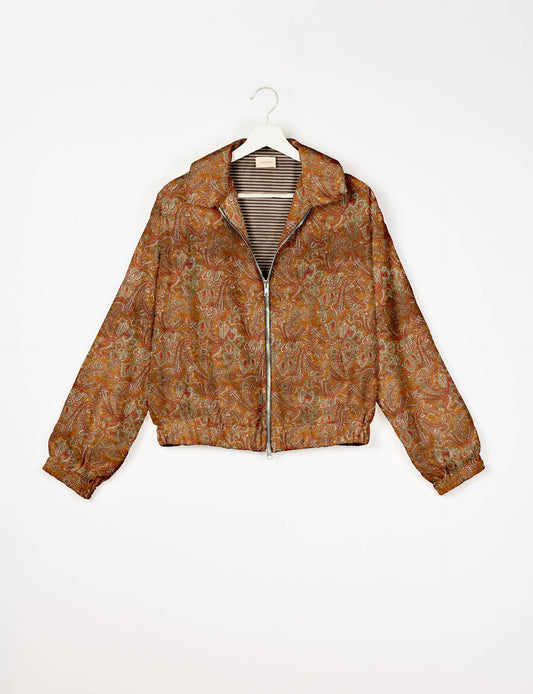 Stylish BOMBER JACKET, an upcycled clothing masterpiece with a cute cropped shape, elasticated details, and detachable metallic zipper. Contrast sari print lining adds a unique touch. Explore sustainable and eco-friendly fashion.