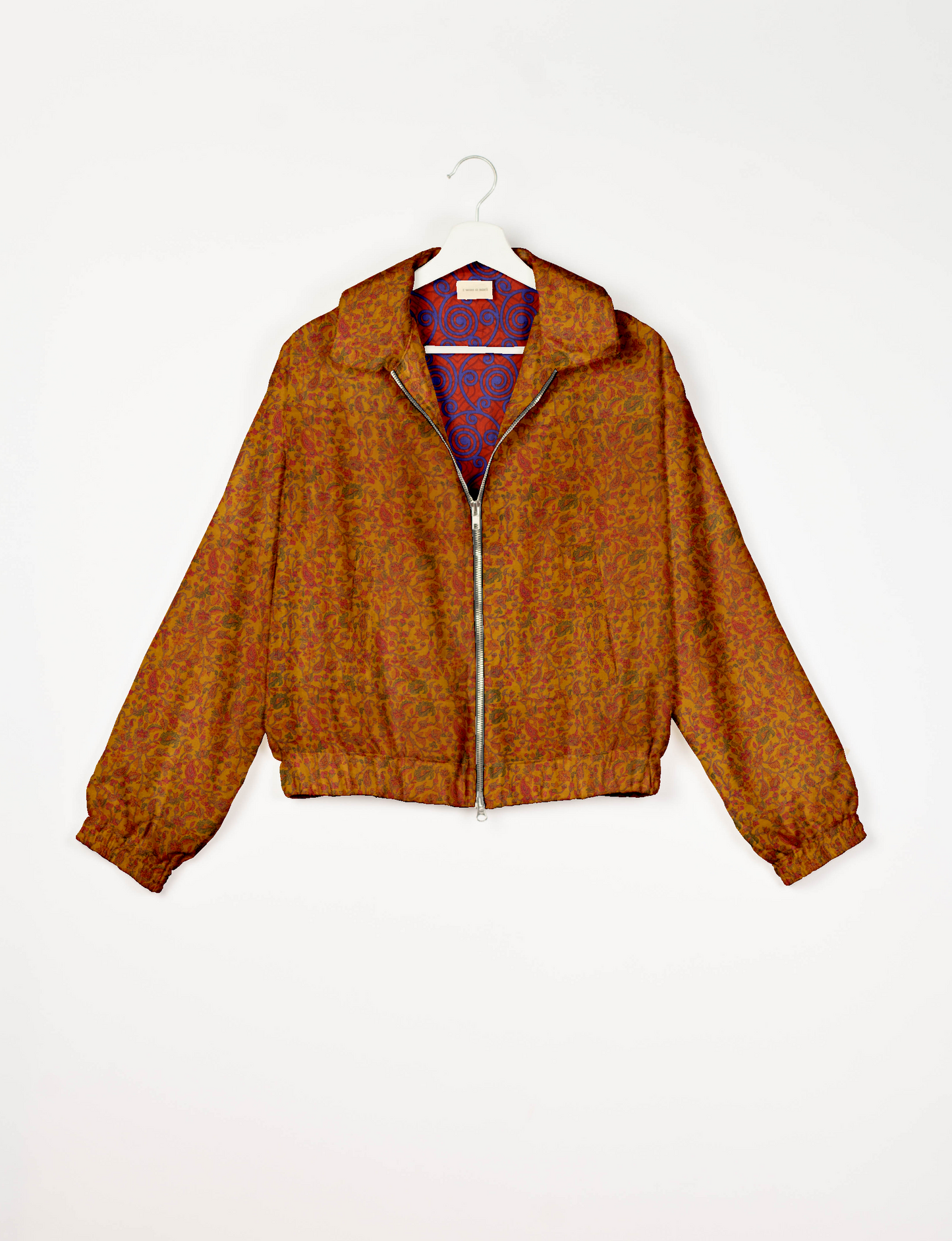 Upcycled Bomber Jacket made from recycled sari materials, featuring a cute cropped shape, elasticated hem and cuffs, and contrast sari print lining. Sustainable apparel promoting eco-friendly fashion and ethical clothing.