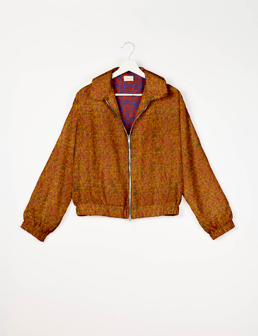 Upcycled Bomber Jacket made from recycled sari materials, featuring a cute cropped shape, elasticated hem and cuffs, and contrast sari print lining. Sustainable apparel promoting eco-friendly fashion and ethical clothing.