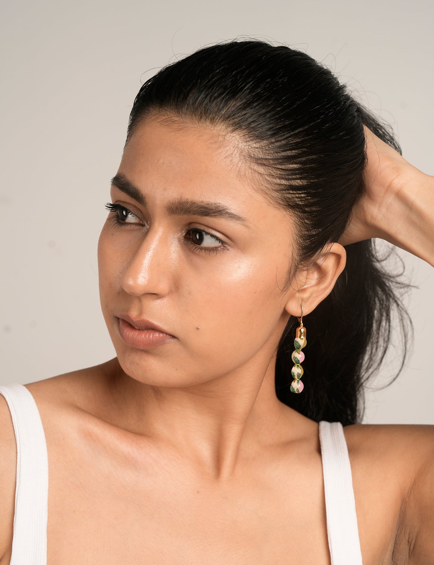 Experience the allure of Beaded Dangler Earrings, a fusion of recycled glass beads and pre-loved sari fabric. Skin-friendly with hypoallergenic hooks, these earrings bring a touch of sustainability to your accessory collection.