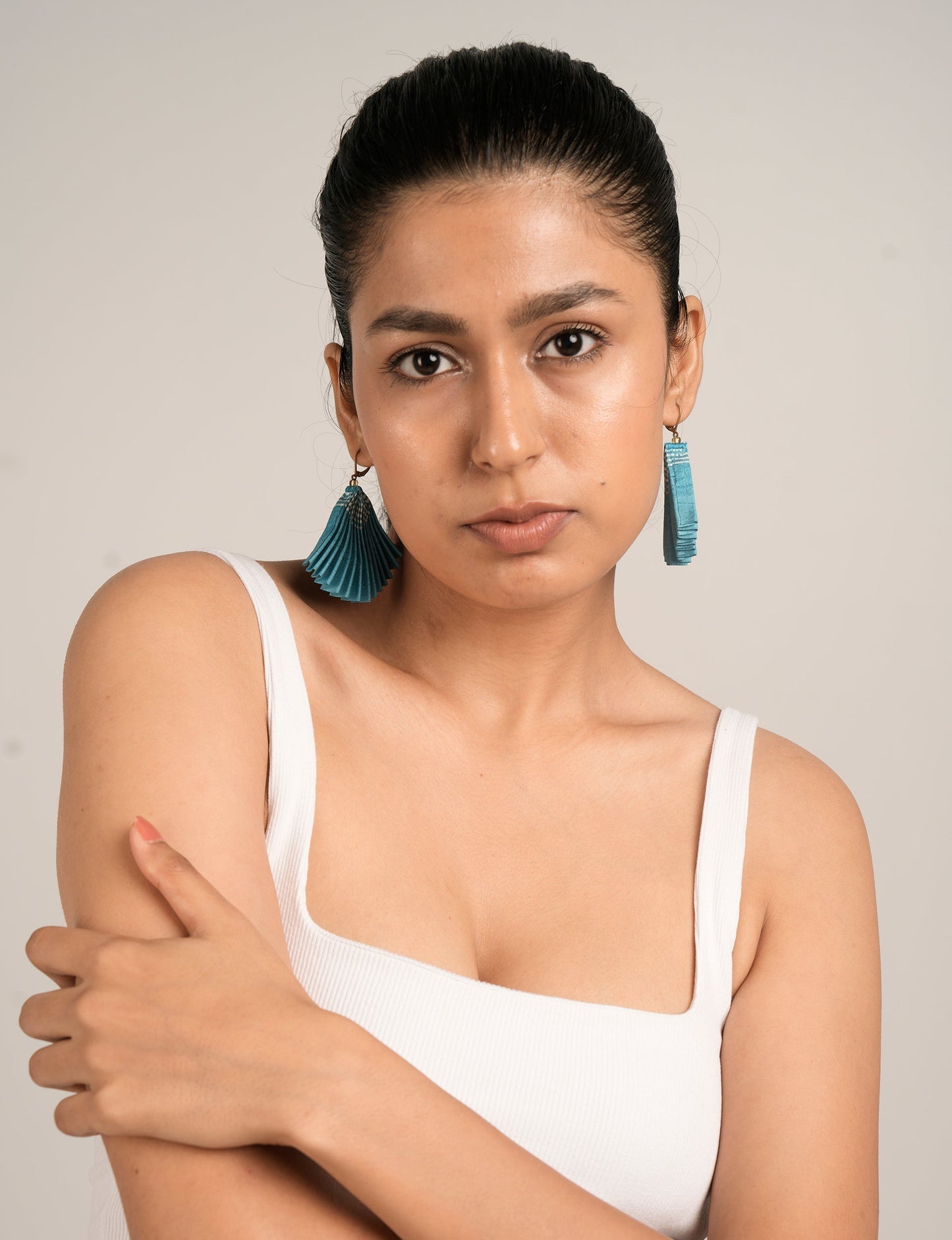 Elevate your style sustainably with our PLEATED EARRINGS – a timeless creation from pre-loved Indian saris, crafted using innovative heat setting techniques. Align with ethical clothing, green fashion, and slow fashion, these earrings are a statement of mindful elegance. Hypoallergy tested metal hooks make them a skin-friendly, sustainable choice.