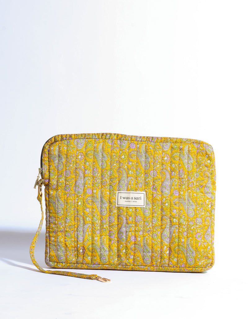 Quilted yellow paisley organizer with zipper and wrist strap, front view, label reading "I was a sari mumbai | milan"