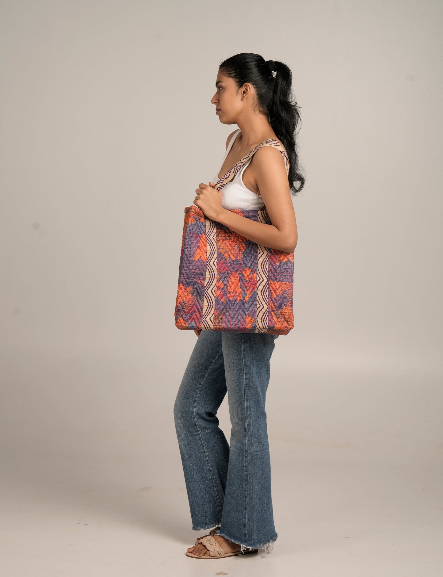 Elevate your style with our Quilted Tote Bag, a perfect fusion of fashion and sustainability. Made from vibrant upcycled saris, the newly quilted design adds strength and softness. With double fabric contrast straps and a unique sari lining, it's a statement of ethical elegance.